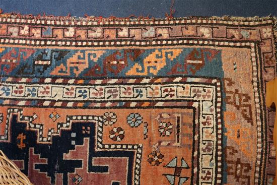 A Derbend apricot ground rug, c.1910, 9ft 6in by 3ft 6in.